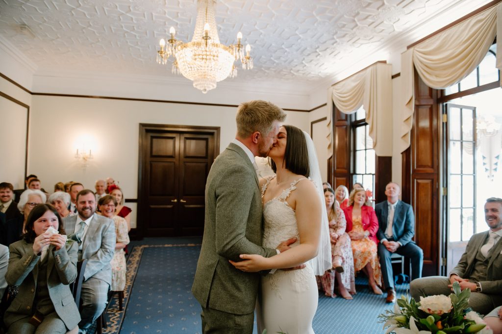 Couple Share First Kiss During Leatherhead Registry Wedding Ceremony 