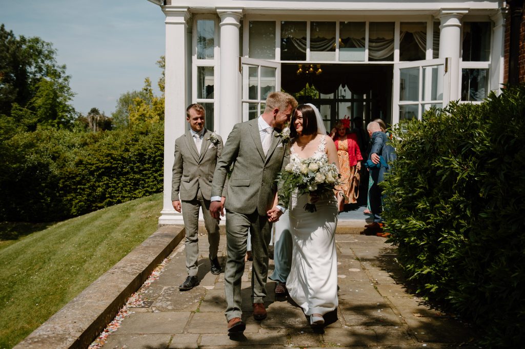 Couple Exit Leatherhead Registry Wedding Together