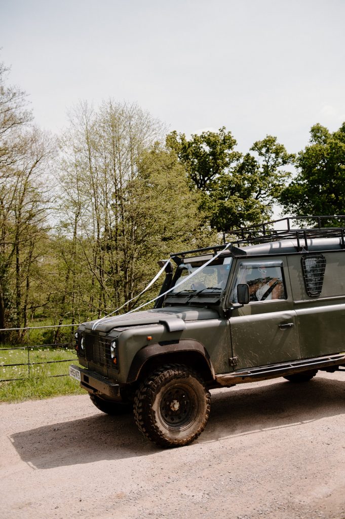 Couple Arrive in Style With Personalised Landrover for Oxenford Farm Barn Wedding 