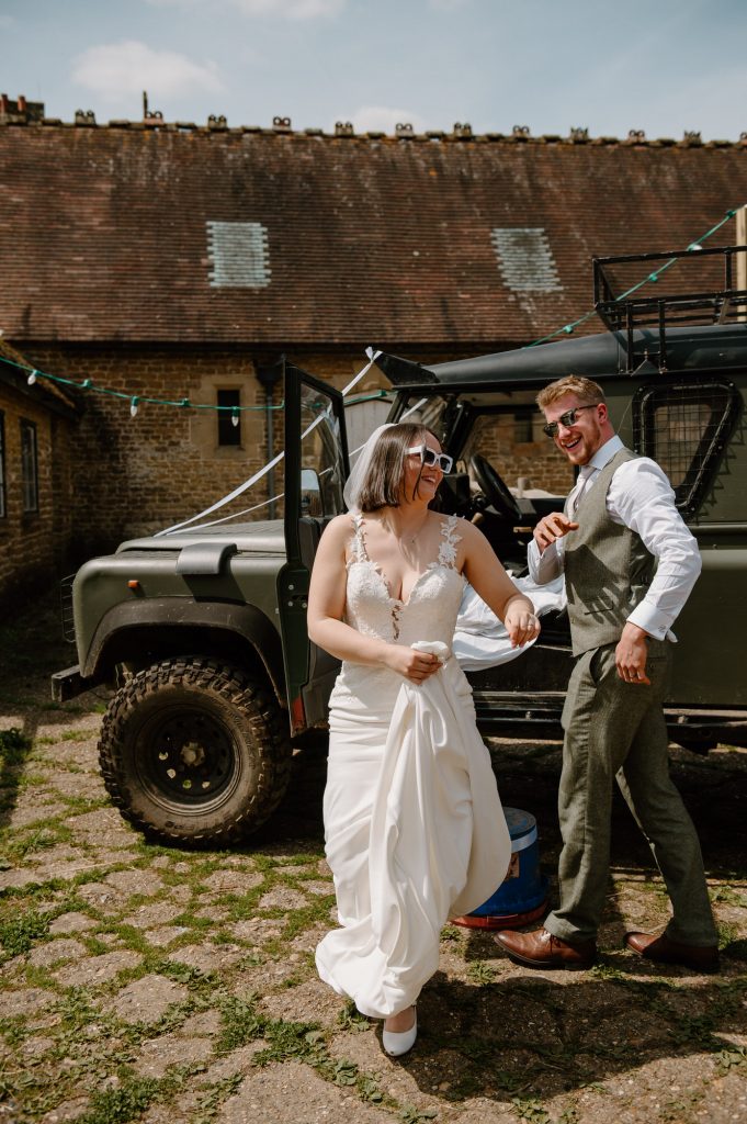 Couple Arrive in Style With Personalised Landrover for Oxenford Farm Barn Wedding 