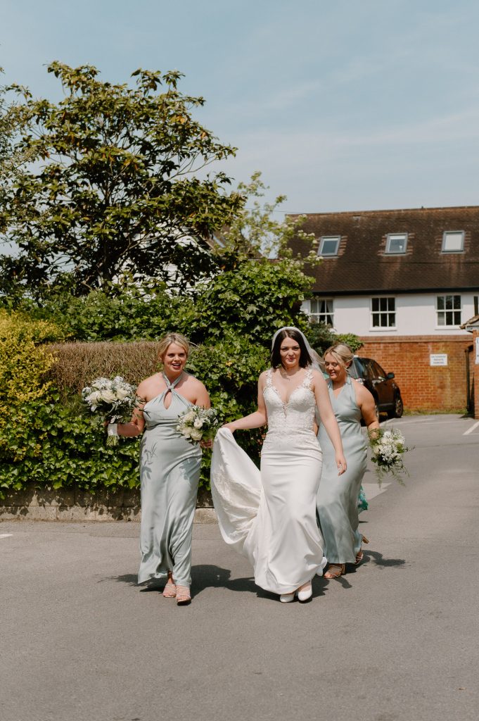 Bride arrives with her bridesmaids for Leatherhead Registry Wedding 