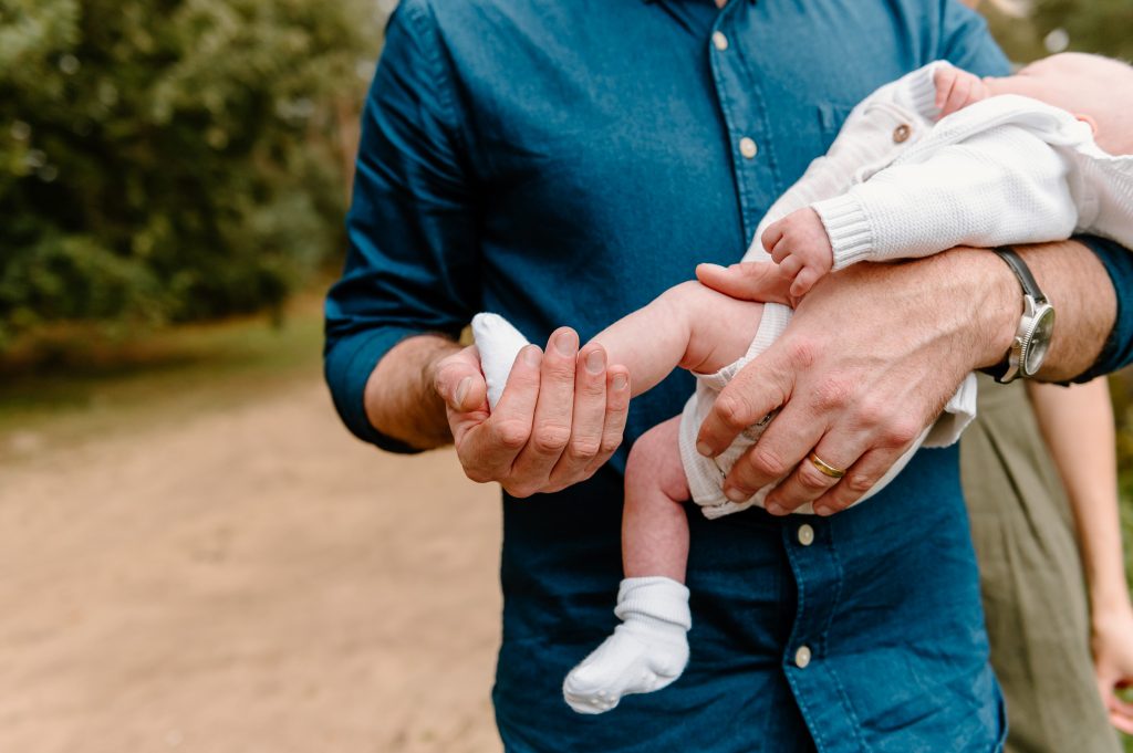 Father Holds Baby Newborn Baby Feet - Surrey Family Photography