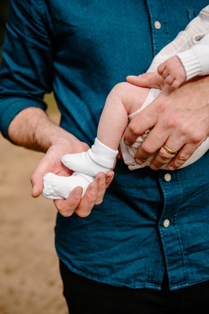 Father Holds Baby Newborn Baby Feet - Surrey Family Photography