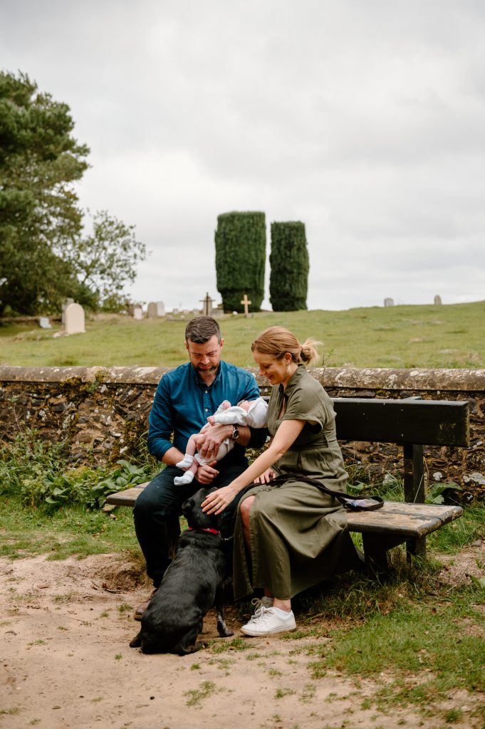 Family Sit Together on Bench Outdoors - Newborn Family Photography